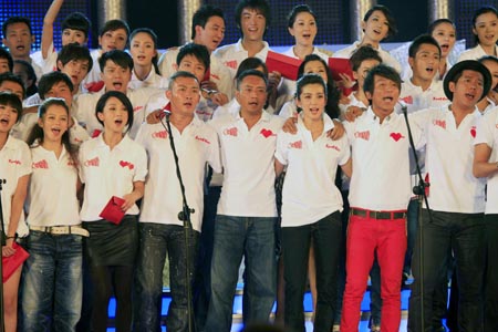 Performers sing a song during a television fundraiser in Beijing, capital of China, on August 20, 2009.