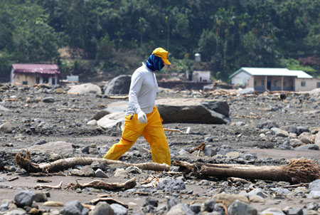 Rescue workers search for the victims of a landslide who were buried days after typhoon Moraket hit the Xiaolin village at Jiaxian township near Kaohsiung county in south China's Taiwan Province, on August 20, 2009. 