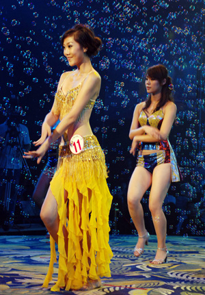 Chinese girls stage performances on the podium as they attend a local Miss Bikini competition in Guangzhou, capital city of south China's Guangdong Province, on August 21, 2009. Chinese girls stage performances on the podium as they attend a local Miss Bikini competition in Guangzhou, capital city of south China's Guangdong Province, on August 21, 2009.