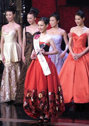 Carly Wong (front) is titled with Miss International Goodwill during the Miss Hong Kong 2009 pageant, in Hong Kong, south China, on August 22, 2009.