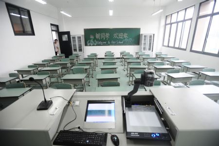 Photo taken on August 26, 2009 show a classroom of Xintanghu elementary school in Shuangliu, a county of southwest China's Sichuan Province. 