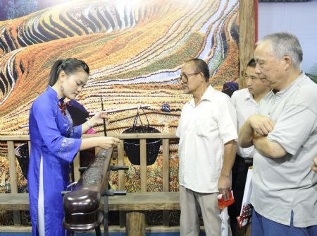 People visit an exhibition of achievements in China's Inner Mongolia, Xinjiang, Guangxi, Ningxia and Tibet autonomous regions, at the Cultural Palace of Nationalities in Beijing, August 26, 2009. The exhibition, which opened on Tuesday, introduces refulgent achievements of the economic development and the national unity in the five Chinese autonomous regions. 