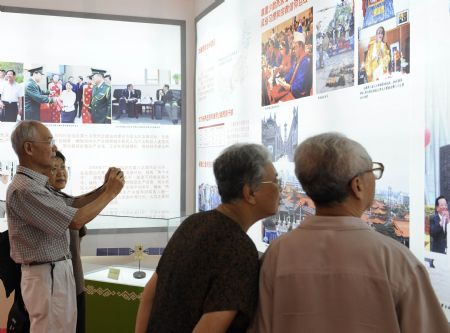 People visit an exhibition of achievements in China's Inner Mongolia, Xinjiang, Guangxi, Ningxia and Tibet autonomous regions, at the Cultural Palace of Nationalities in Beijing, August 26, 2009. The exhibition, which opened on Tuesday, introduces refulgent achievements of the economic development and the national unity in the five Chinese autonomous regions.