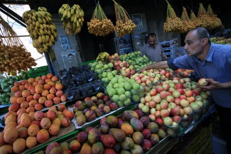 A Palestinian buys goods at a market during the holy fasting month of Ramadan, in Gaza City, August 26, 2009.