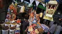 Palestinians buy goods at a market during the holy fasting month of Ramadan, in Gaza City, August 26, 2009.