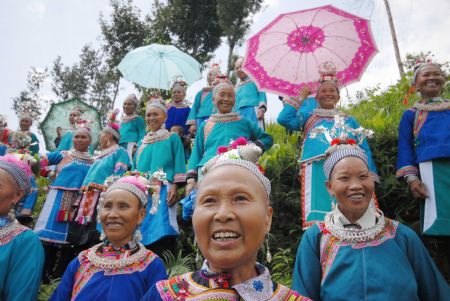 Villagers of the Miao ethnic group sing folk songs at the Chixin Festival, or New Grain Tasting Festival, in a village of the Miao ethnic group in Duyu City of southwest China's Guizhou Province, August 28, 2009.