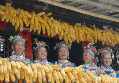 Villagers of the Miao ethnic group sing folk songs at the Chixin Festival, or New Grain Tasting Festival, in a village of the Miao ethnic group in Duyu City of southwest China's Guizhou Province, August 28, 2009. 