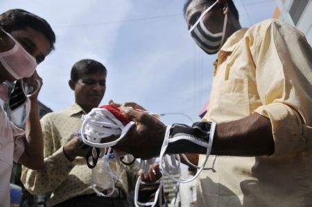 Citizens purchase masks in Dhaka, capital of Bangladesh, September 3, 2009.