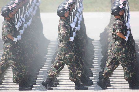 Photo taken on July 3, 2009 shows Chinese soldiers take part in parade training in Beijing, capital of China. 