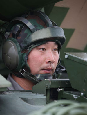 Photo taken on August 7, 2009 shows Chinese soldier Ding Hui taking part in parade training in Beijing, capital of China. 