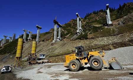 This photo taken on September 3, 2009 shows a section of a expressway connecting Sayram Lake and Guozigou being constructed above Tianshan Mountains in northwest China&apos;s Xinjiang Uygur Autonomous Region.