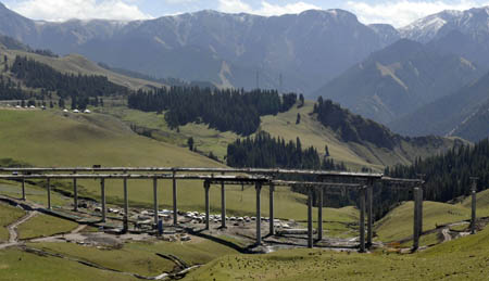 This photo taken on September 3, 2009 shows a section of a expressway connecting Sayram Lake and Guozigou being constructed above Tianshan Mountains in northwest China&apos;s Xinjiang Uygur Autonomous Region.