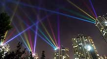 Photo taken on September 6, 2009 shows the dazzling searchlight intersection as the National Day Celebration nocturnal illuminations are in the process of readjustment, along the bank of the Suzhou River, in downtown Shanghai, east China.