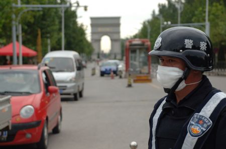 A policeman guards an entrance to the university town in Langfang, northern China's Hebei Province, Sept. 7, 2009. (Xinhua/Gong Zhihong)