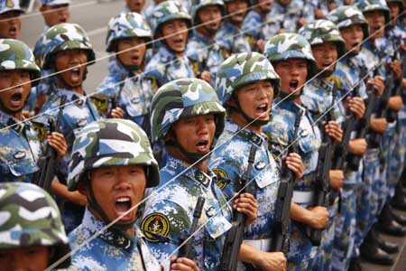 Photo taken on June 26, 2009 shows Chinese soldiers taking part in the parade training with the help of the strings in Beijing, capital of China. Participants are busy doing exercises to prepare for the scheduled military parade at the Tian&apos;anmen square in Beijing to celebrate the 60th anniversary of the founding of the People&apos;s Republic of China on October 1. 