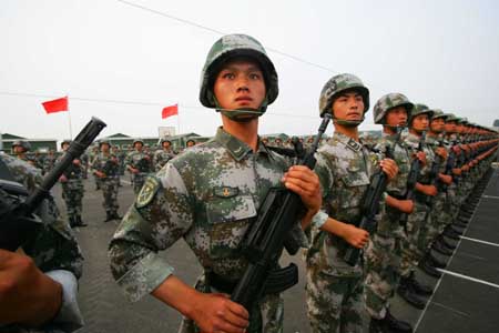 Photo taken on June 25, 2009 shows Chinese soldiers taking part in the parade training with the help of the strings in Beijing, capital of China