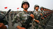 Photo taken on June 25, 2009 shows Chinese soldiers taking part in the parade training with the help of the strings in Beijing, capital of China.