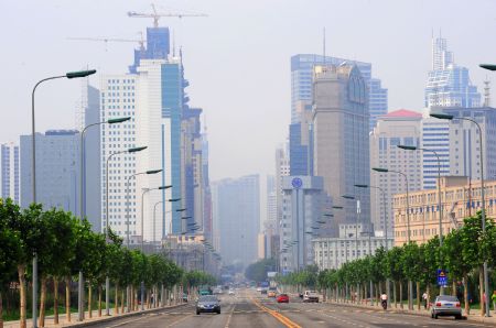 Photo taken on September 5, 2009 shows high buildings at coastal region of Dalian Economic Development District in Dalian, northeast China&apos;s Liaoning Province.[