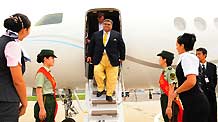 Iraqi Youth and Sports Minister Jassim Mohammed Jaafar steps down aircraft upon his arrival at the airport of Dalian, northeast China's Liaoning Province, September 7, 2009.