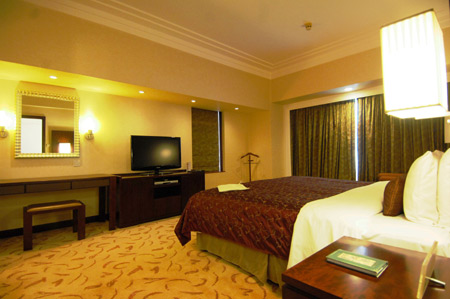 Picture taken on September 7, 2009 shows the bedroom prepared for Klaus Schwab, founder and chairman of the World Economic Forum (WEF), at the Shangrila Hotel in Dalian, northeast China's Liaoning Province.