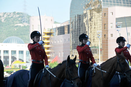 Horseback policewomen form up outside the Dalian World Expo Center, the main meeting center of the Annual Meeting of the New Champions 2009, in Dalian, northeast China's Liaoning Province on September 9, 2009. 