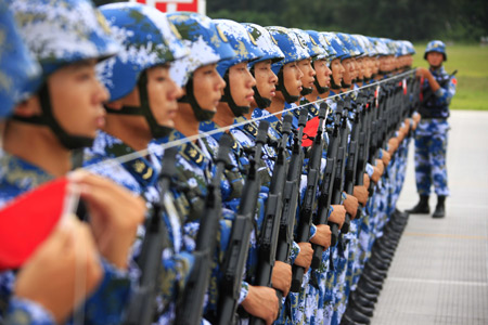 Photo taken on August 21, 2009 shows Chinese soldiers take part in the parade training in Beijing, capital of China. Participants are busy doing exercises to prepare for the scheduled military parade at the Tian'anmen square in Beijing to celebrate the 60th anniversary of the founding of the People's Republic of China on October 1. 