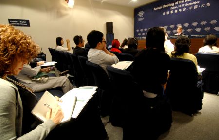 Journalists listen at a news conference held by Boston Consulting Group during the Annual Meeting of the New Champions 2009, or Summer Davos, in Dalian, northeast China's Liaoning Province, September 10, 2009.