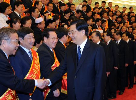 Chinese leaders Hu Jintao, Wen Jiabao, Li Changchun and Xi Jinping shake hands with representatives of outstanding teachers in Beijing, capital of China, on September 9, 2009. [