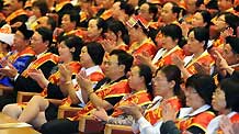 Representatives attend a meeting to honor outstanding teachers in Beijing, capital of China, September 9, 2009, on the eve of China's 25th Teachers' Day.