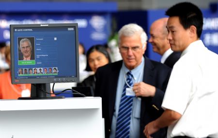 Participants check in for the first day meeting of the Annual Meeting of the New Champions 2009, or Summer Davos, in Dalian, northeast China&apos;s Liaoning Province, September 10, 2009. 