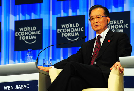Chinese Premier Wen Jiabao attends the opening plenary of the Annual Meeting of the New Champions 2009, or the Summer Davos, in Dalian, northeast China's Liaoning Province, September 10, 2009. 