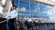 Mounted policewomen patrol outside the Dalian World Expo Center, the venue of the Annual Meeting of the New Champions 2009, or Summer Davos, in Dalian, northeast China's Liaoning Province, September 12, 2009.