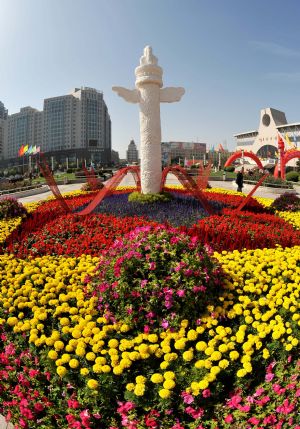 Flowers are displayed at a square in Yinchuan, capital of northwest China's Ningxia Hui Autonomous Region, to celebrate the upcoming National Day of China September 14, 2009. Chinese people celebrate the comming 60th anniversary of the founding of the People's Republic of China, which falls on October 1, 2009. 