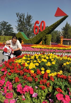 Flowers are displayed at a square in Yinchuan, capital of northwest China's Ningxia Hui Autonomous Region, to celebrate the upcoming National Day of China September 14, 2009.