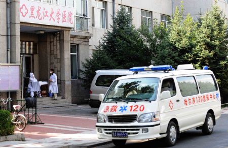 An ambulance is seen in front of the clinic of Heilongjiang University in Harbin, capital of northeast China's Heilongjiang Province, September 14, 2009. 