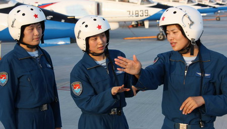 Three female pilots discuss flying techniques at an airport in Beijing, China, in this photon taken on July 14.