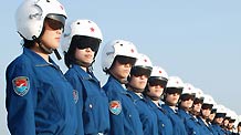 Female pilots line up before training starts at an airport in Beijing, China, in this photo taken on July 14.