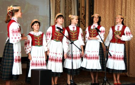 Students who learn Chinese language at the 23rd Liberal Arts School perform for the upcoming Chinese National Day in Minsk, capital of Belarus, September 16, 2009.