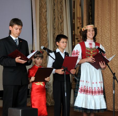 Students who learn Chinese language at the 23rd Liberal Arts School perform for the upcoming Chinese National Day in Minsk, capital of Belarus, September 16, 2009.