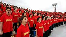 Singers rehearse the Yellow River Cantata in Shanghai, east China, September 18, 2009. The cantata, with participation of more than 22,000 people, will be staged with live broadcasting in 10 provinces and regions on Saturday to commemorate the 70th anniversary of the cantata composed by Xian Xinghai, a famous Chinese composer, and the 60th birthday of the People's Republic of China.