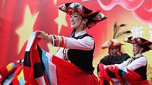 Dancers in traditional costumes perform during a cultural and art festival held at the Taoyuan Plaza in Kunming, capital of southwest China's Yunnan Province, September 19, 2009. Performances of the 29th Panlongjiang Cultural and Art Festival was held in Kunming on Saturday.