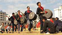 Performers revel in the bamboo dance to mark the forthcoming grand celebration of the 60th anniversary of the founding of the People's Republic of China, at Hechi City, southwest China's Guangxi Zhuang Autonomous Region, September 19, 2009.