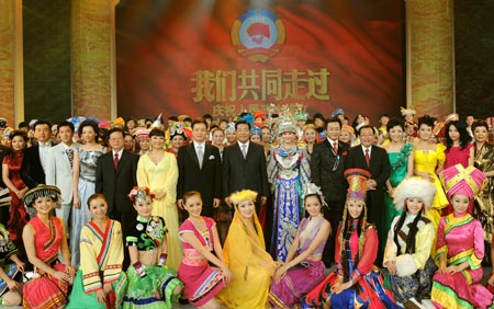 Jia Qinglin (C, 2nd row), chairman of the National Committee of the Chinese People's Political Consultative Conference (CPPCC), poses for a group photo after watching an art performance celebrating the 60th anniversary of the founding of the CPPCC, the country's top political advisory body, in Beijing, China, on September 20, 2009. 