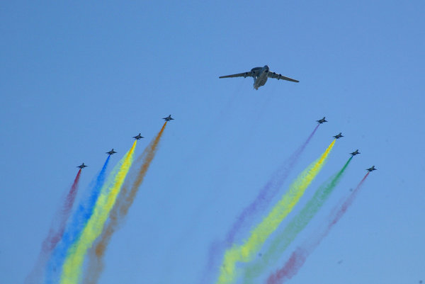 Chinese People's Liberation Army air force jets fly over central Beijing during rehearsals for the country's 60th National Day celebrations, in China, Monday, September 21, 2009. 