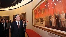 Li Congjun, president of Xinhua News Agency and director of an exhibition of artworks reflecting China's major historical subjects since 1840, visits the exhibition at the National Art Museum in Beijing, capital of China, on September 22, 2009.