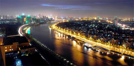 Photo taken on September 22, 2009 shows the night scene of Haihe River in Tianjin, China. Haihe River has been illuminated to welcome the 60th anniversary of the founding of People's Republic of China. 