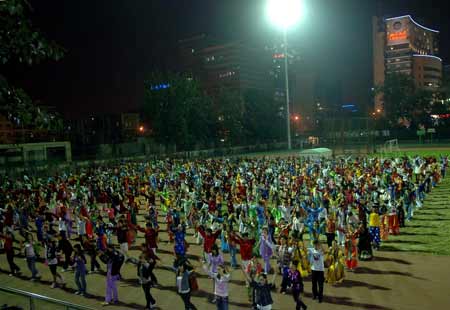 Students of Central University for Nationalities attend a rehearsal for the upcoming National Day massive celebration, in Beijing, September 22, 2009.