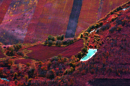 Aerial photo taken on September 23, 2009 shows the scenery of the Greater Khingan range in north China's Inner Mongolia Autonomous Region. The local eco-environment has witnessed a great improvement thanks to the local government's efforts to restore the eco-system.