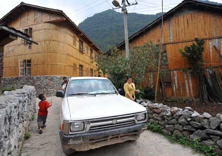 A car owned by a family of Dark Cloth Zhuang is seen in Napo county, southwest China's Guangxi Zhuang Autonomous Region, September 23, 2009.