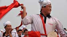 Members of waist drum dance team from Ansai County of northwest China's Shaanxi Province perform during their rehearsal for the upcoming National Day massive celebration, in Beijing, September 25, 2009.